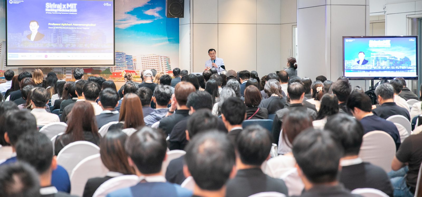 A full auditorium during a summit session